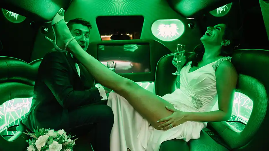 a couple in a limousine las vegas wedding photograper